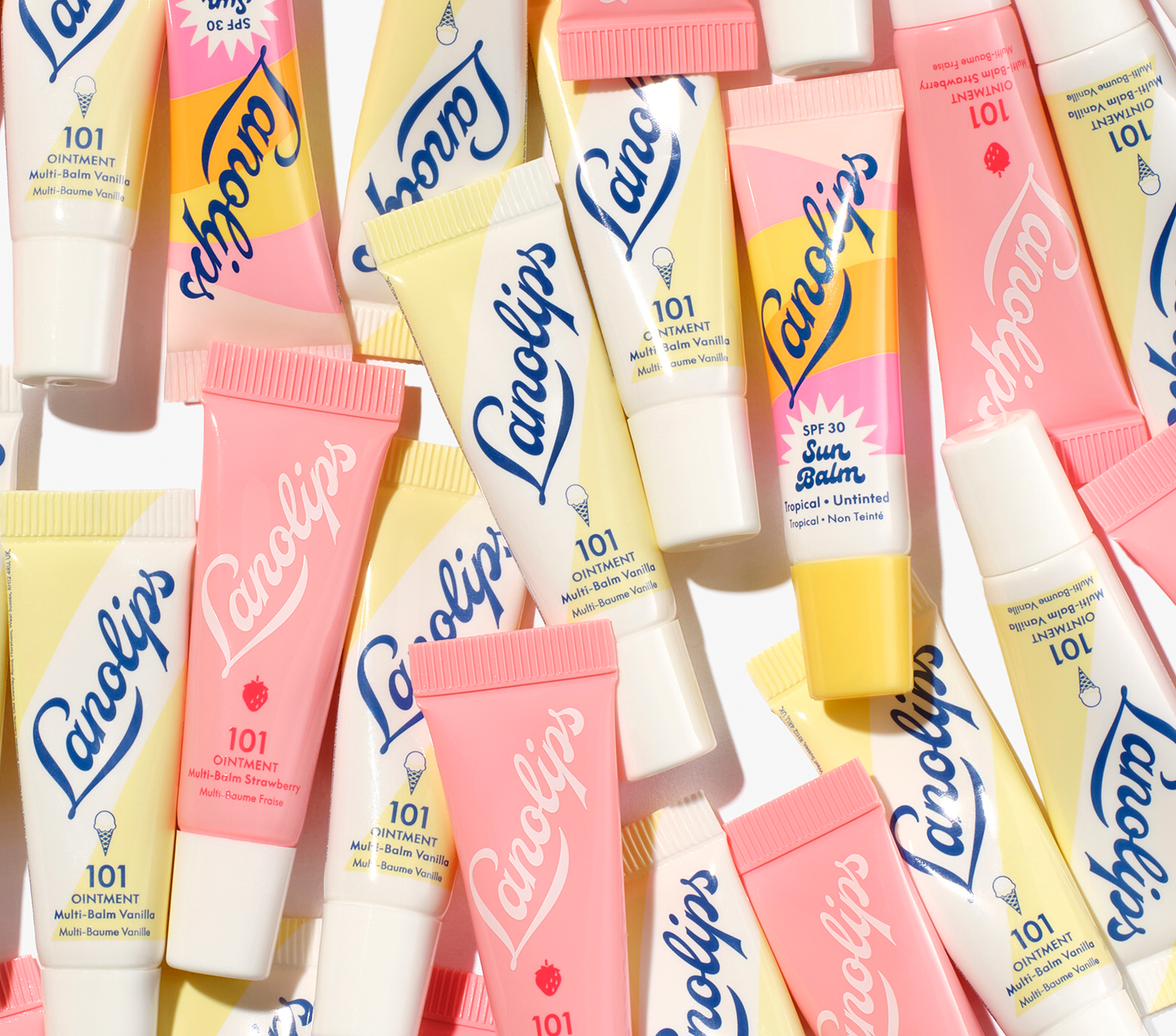 close up of the lanolips sunny bites mini pack mini lip balm tubes, 101 ointment vanilla, strawberry and sun balm spf 30 tropical.
